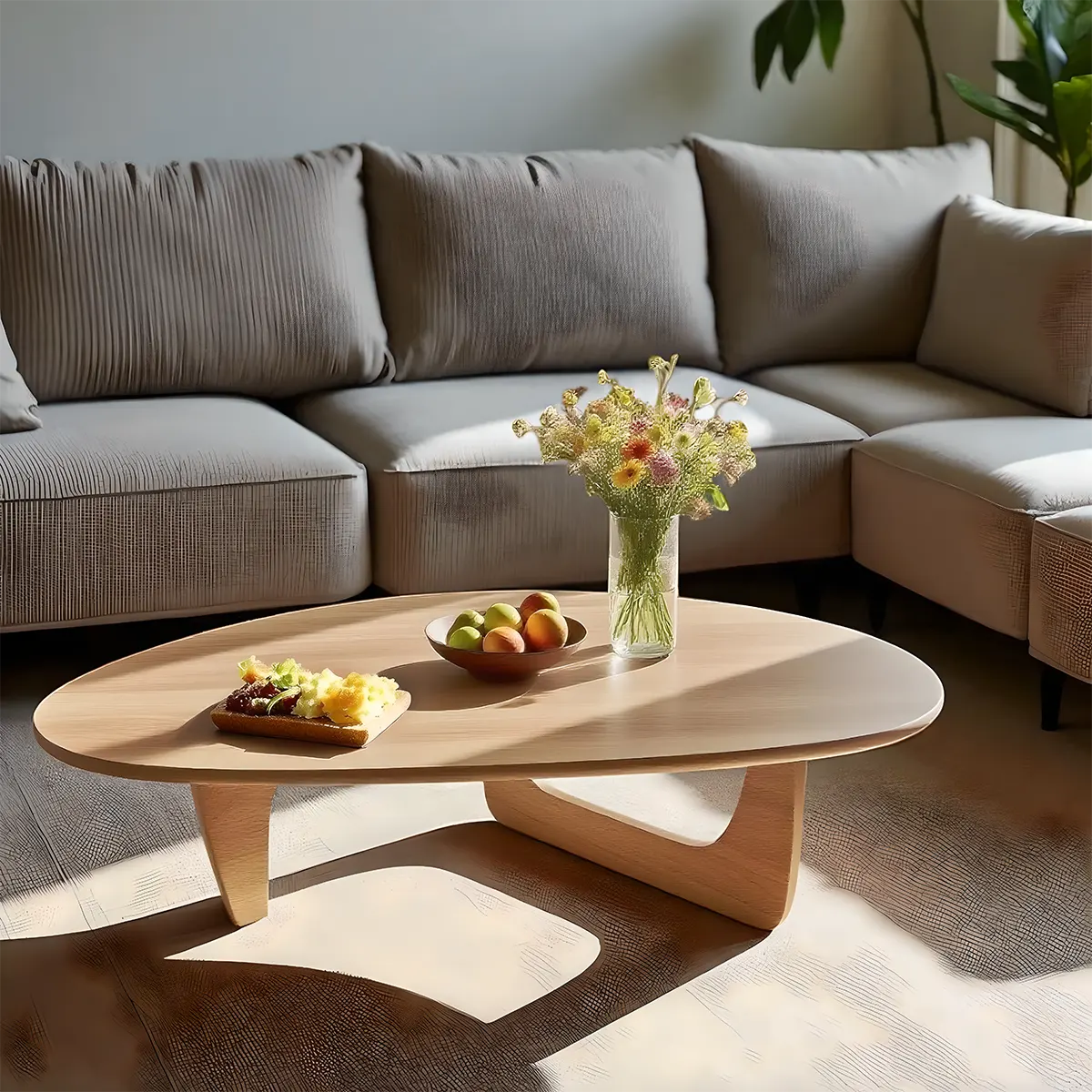 Minimalist round wooden coffee table, gently curved design combined with colors create a soft, cozy feeling