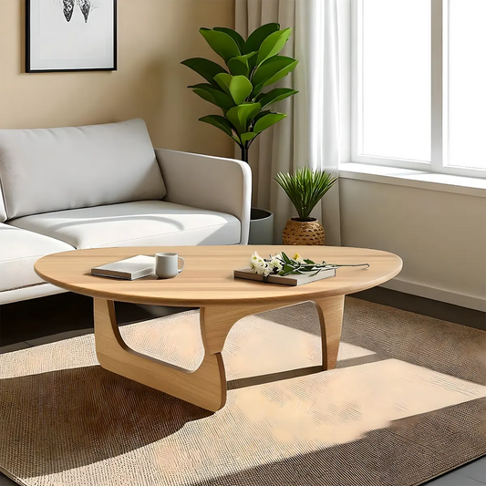 Minimalist round wooden coffee table, gently curved design combined with colors create a soft, cozy feeling 